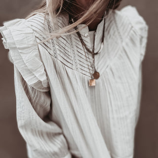 Loryn smocked white linen blouse