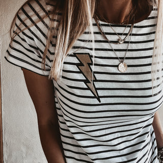 Gold lighting on light Breton striped tee