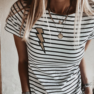 Gold lighting on light Breton striped tee