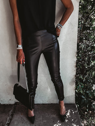 Assos black faux leather skinny pants