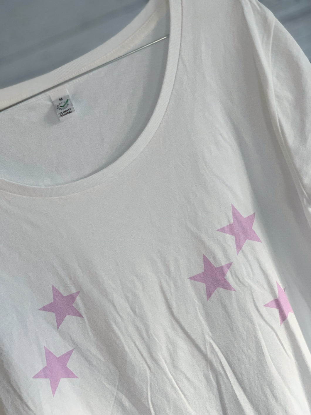 Scattered pink stars on a white tee (size medium uk 12)