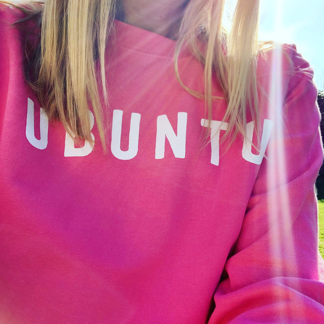White UBUNTU on bright pink sweatshirt