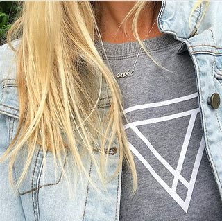 White triangles on light grey sweat