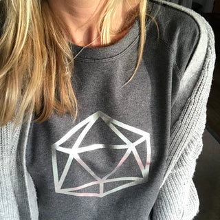 Metallic silver octahedron on a dark grey sweat