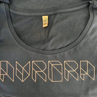 Pink geometric aurora font on denim blue tee