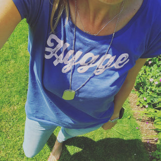 Pink hygge on denim blue tee *pre-loved*