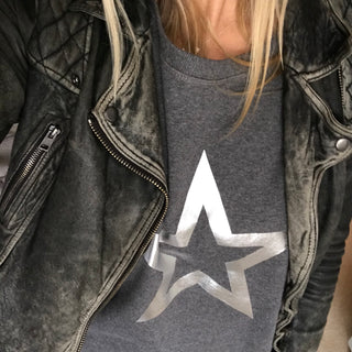 Silver star outline on a dark grey sweat (M)
