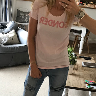 Red SONDER on pink tee