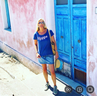 Pink hygge on denim blue tee *pre-loved*