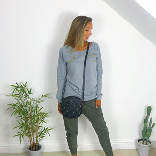 Gold scattered stars on a grey sweat