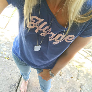 Pink hygge on denim blue tee *pre-loved*