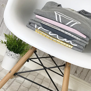 White triangles on light grey sweat