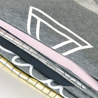 White triangles on light grey sweat