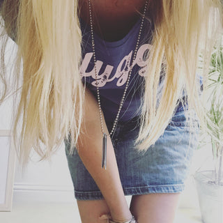 Pink hygge on denim blue tee *pre-loved*