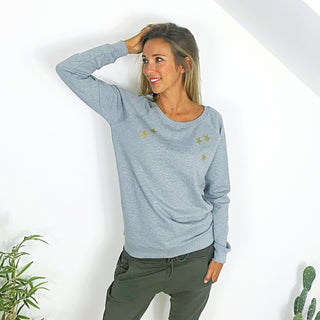 Gold scattered stars on a grey sweat