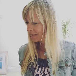 Pink hygge on denim blue tee *pre-loved*