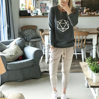 Metallic silver octahedron on a dark grey sweat