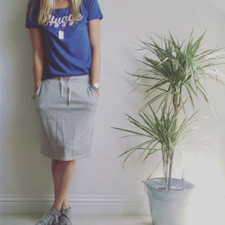 Pink hygge on denim blue tee *pre-loved*