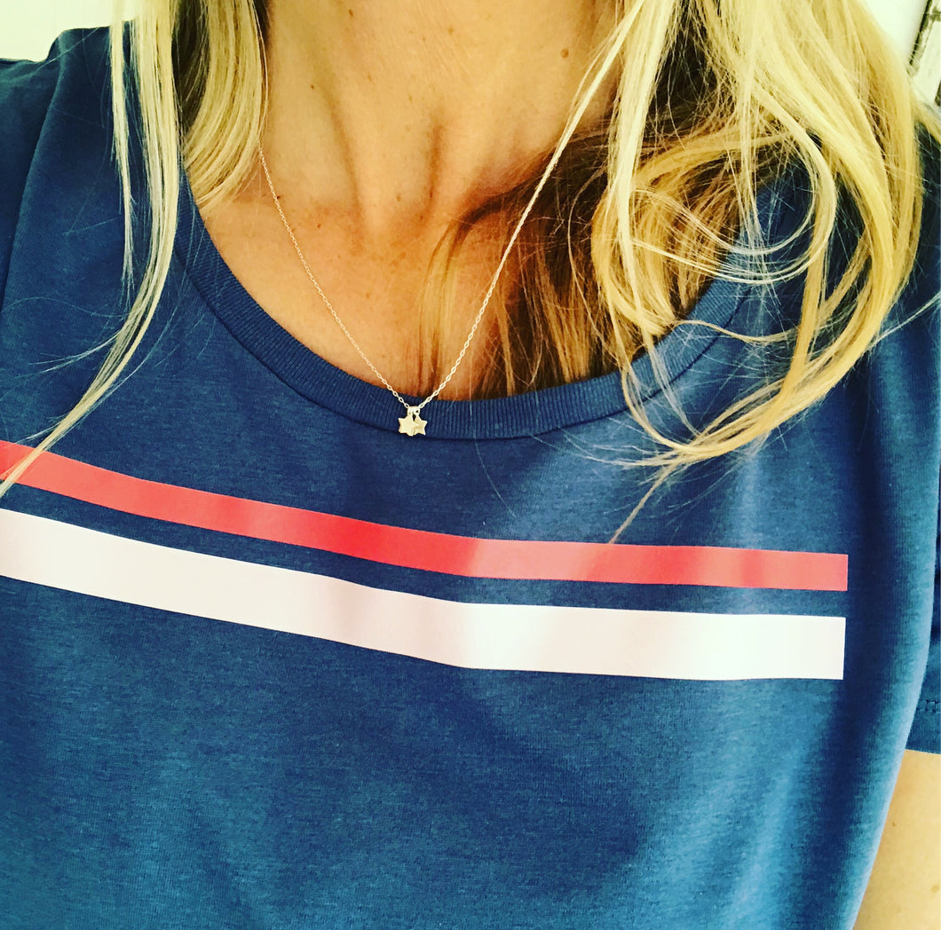 Red and pink stripes on denim blue tee