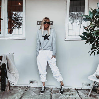 Black star on grey sweatshirt