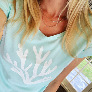 White coral on mint green tee