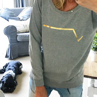 Gold diagonal stripe on light grey sweatshirt