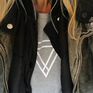 White triangles on light grey sweat
