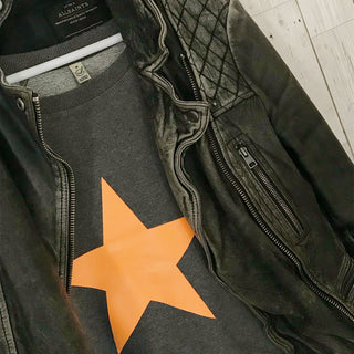 Neon orange star on dark grey sweat