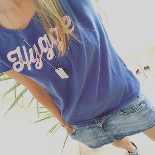 Pink hygge on denim blue tee *pre-loved*
