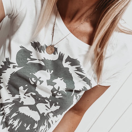 Grey lion on white tee