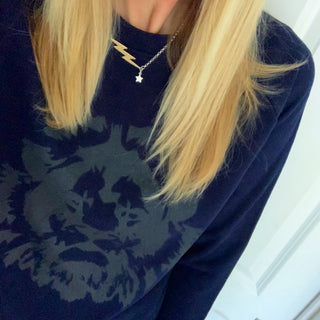 Black lion on navysweatshirt