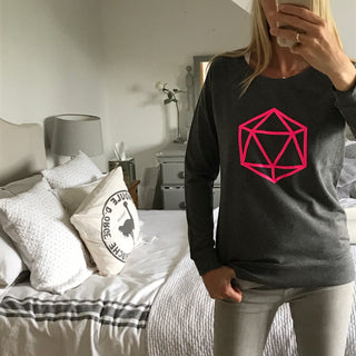 Neon pink octahedron on a dark grey sweatshirt