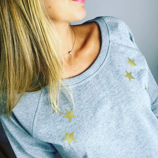 Gold scattered stars on a grey sweat
