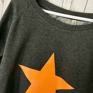 Neon orange star on dark grey sweat