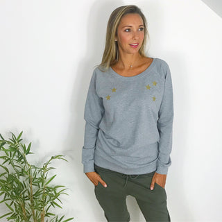 Gold scattered stars on a grey sweat