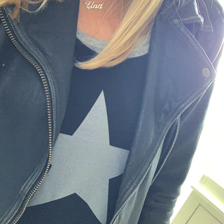 Silvery grey star on black vest top